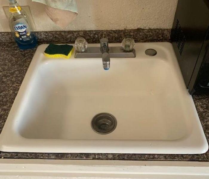 white sink with no dirt after being cleaned
